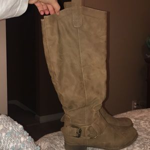 Womens soft brown tall boots.